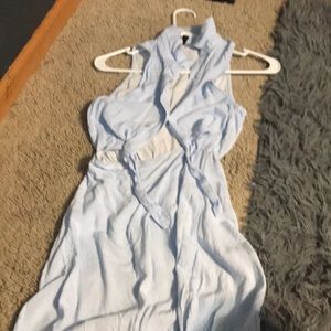 blue and white stripped dress with a tie at the stomach and buttons at the top